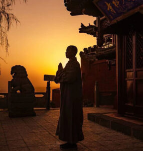 Wing Chun student practising Siu Nim Tao form alone with focused expression