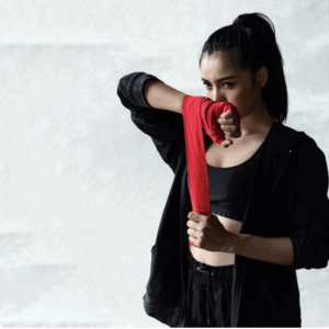 Woman wrapping hands for Wing Chun training, symbolising confidence and inner strength