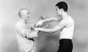 Yip Man training Chi Sau with Bruce Lee